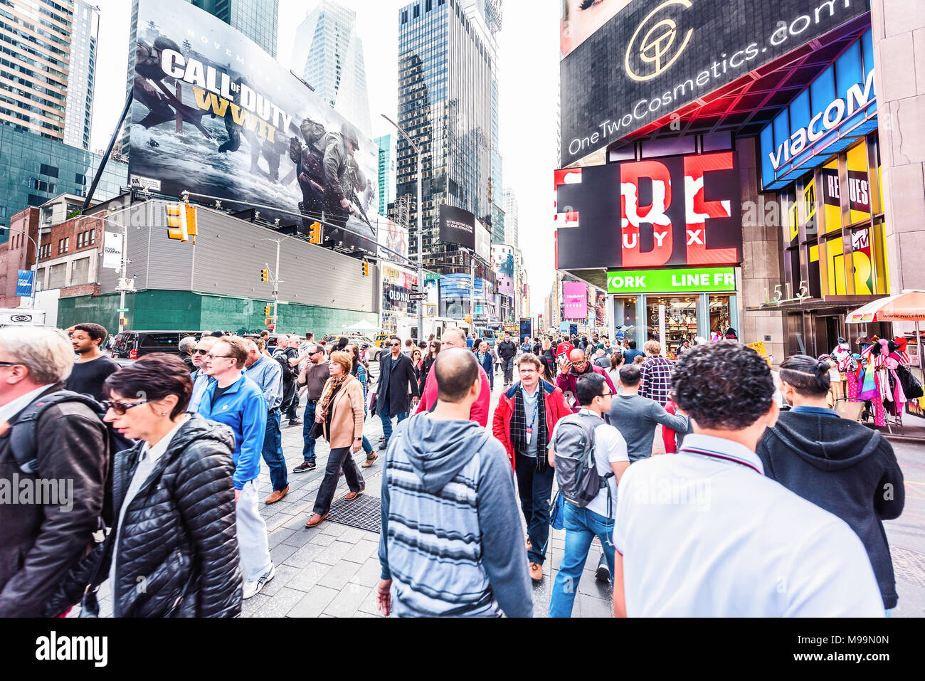 New York City, USA - October 28, 2017: Manhattan NYC buildings of midtown Times Square, Broadway avenue road, signs ads, many large huge crowd of peop Stock Photo