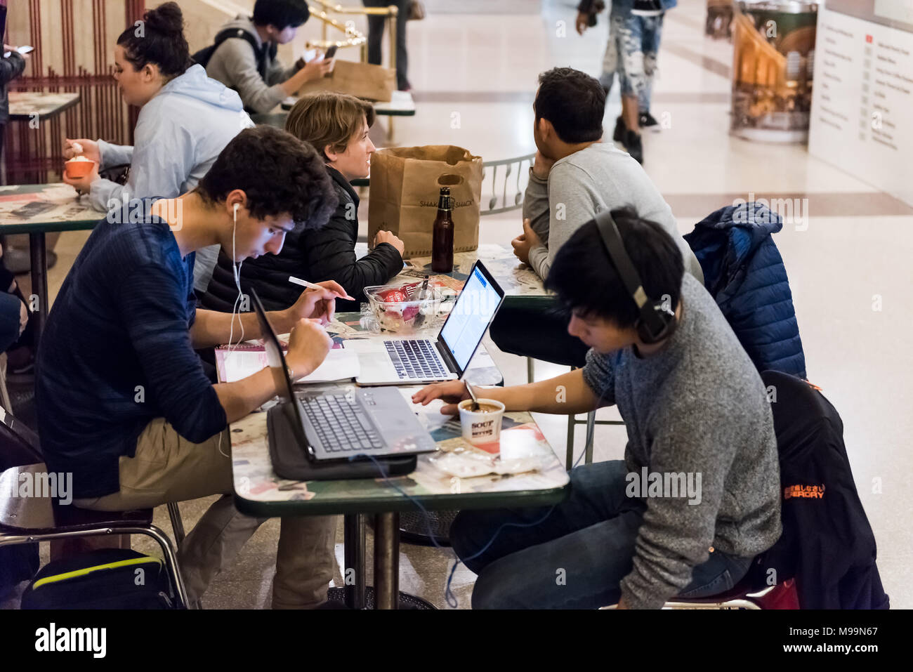 New York, USA - October 29, 2017: Grand central terminal food court restaurant in New York City with people sitting at tables in store shop eating, di Stock Photo