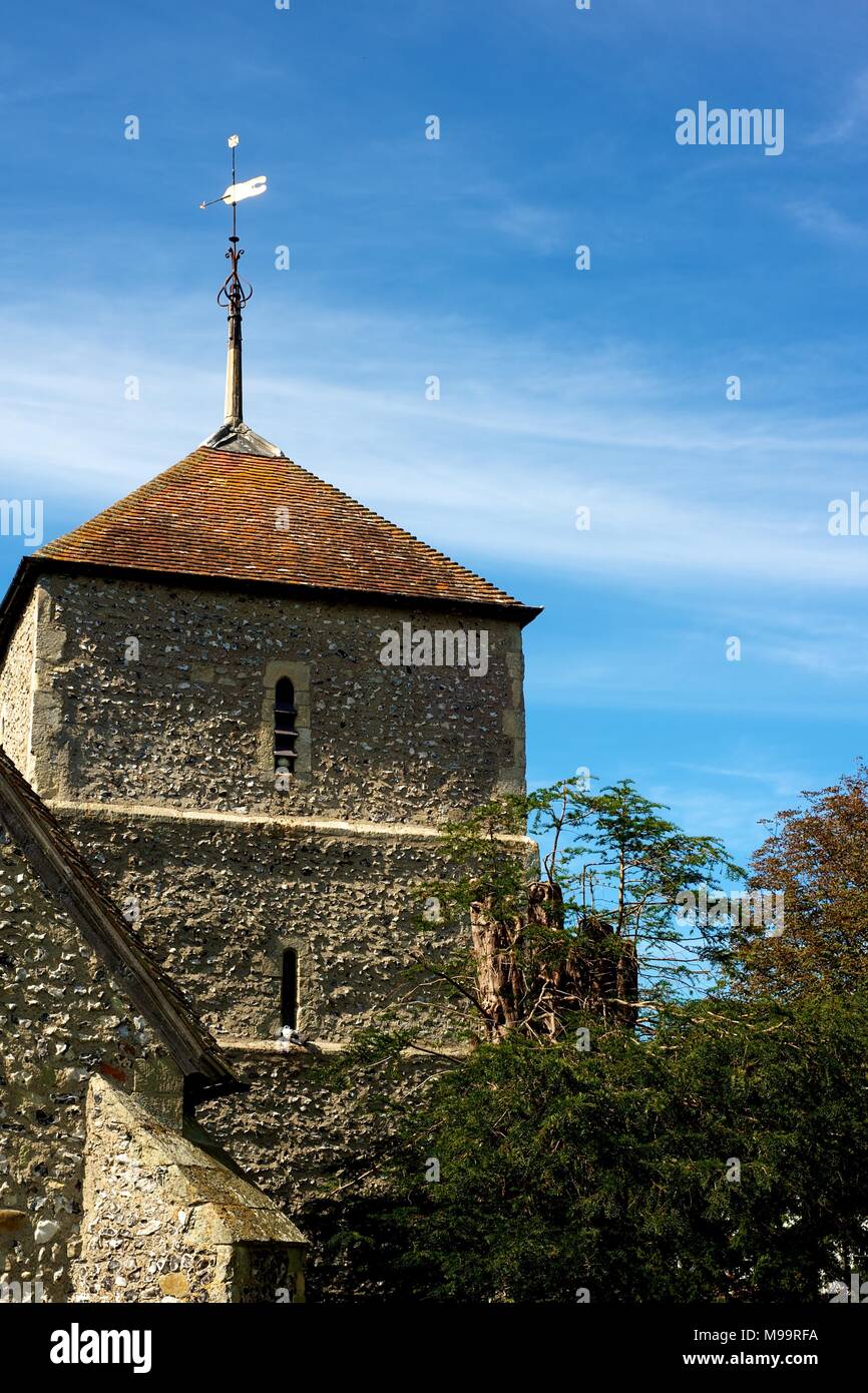 Village church and tower in the beautiful village of East Dean, Sussex, England, on a summer day Stock Photo