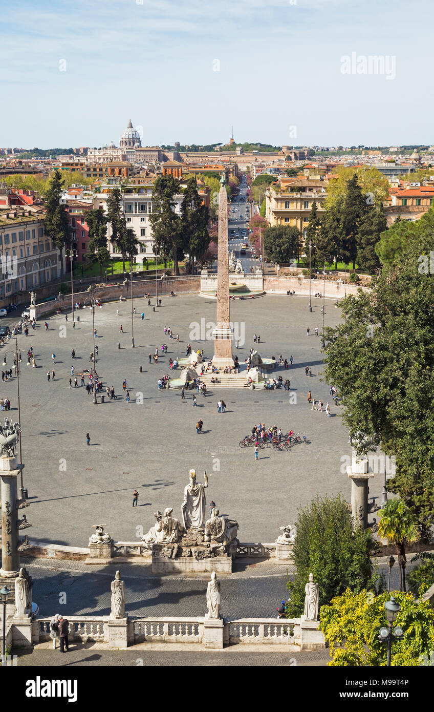 Rome, Italy. Piazza del Popolo. The obelisk was brought from Heliopolis, Egypt during the reign of the Emperor Augustus.  St Peter’s can be seen in th Stock Photo