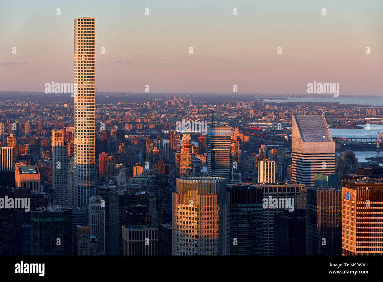 Aerial Sunset view of the skyscrapers of Midtown Manhattan and 432 Park Avenue luxury building (tallest residential building in USA, as of April 2018) Stock Photo
