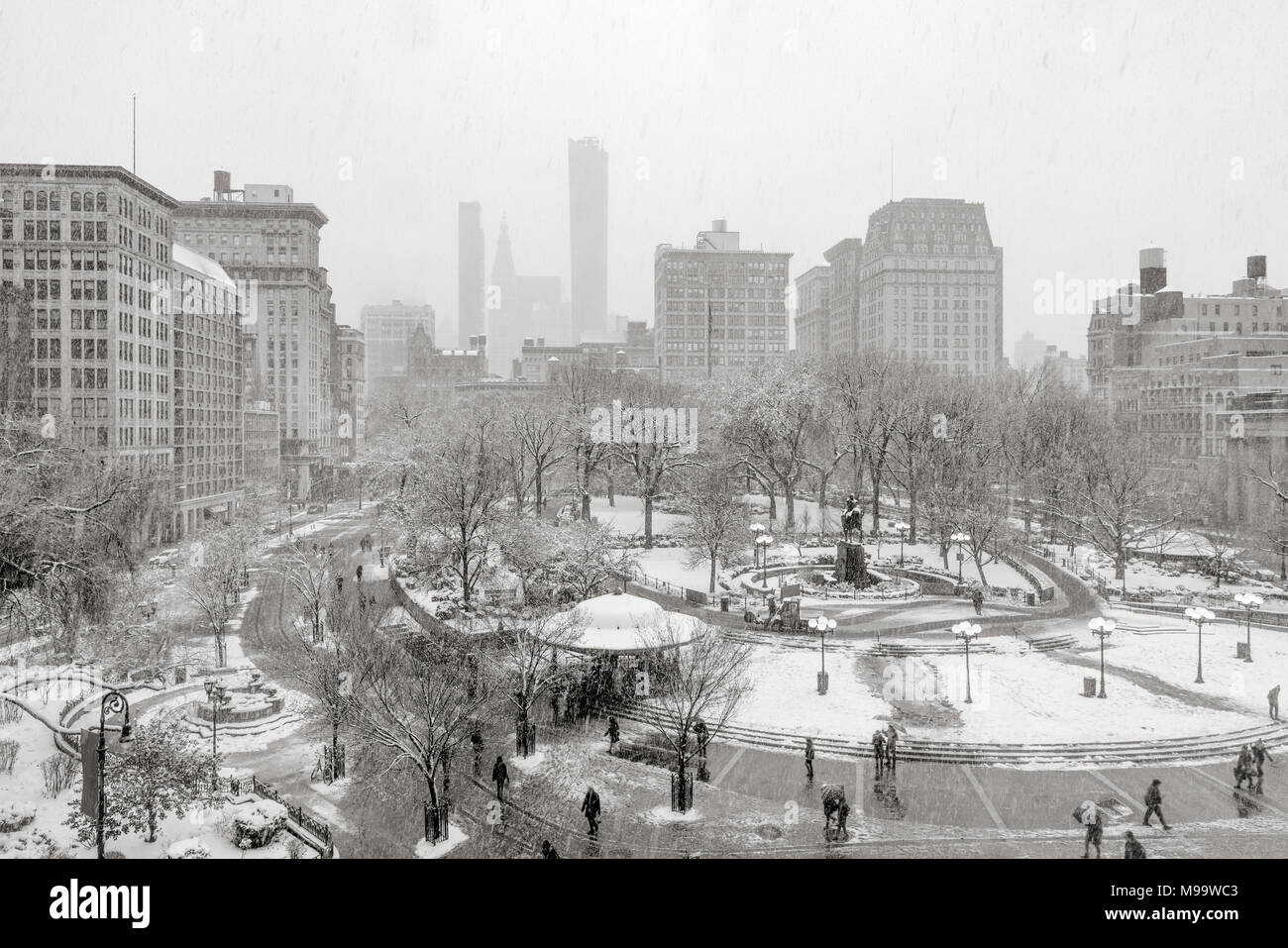 Union Square Park in winter under snow (Black& White). Manhattan, New York City Stock Photo