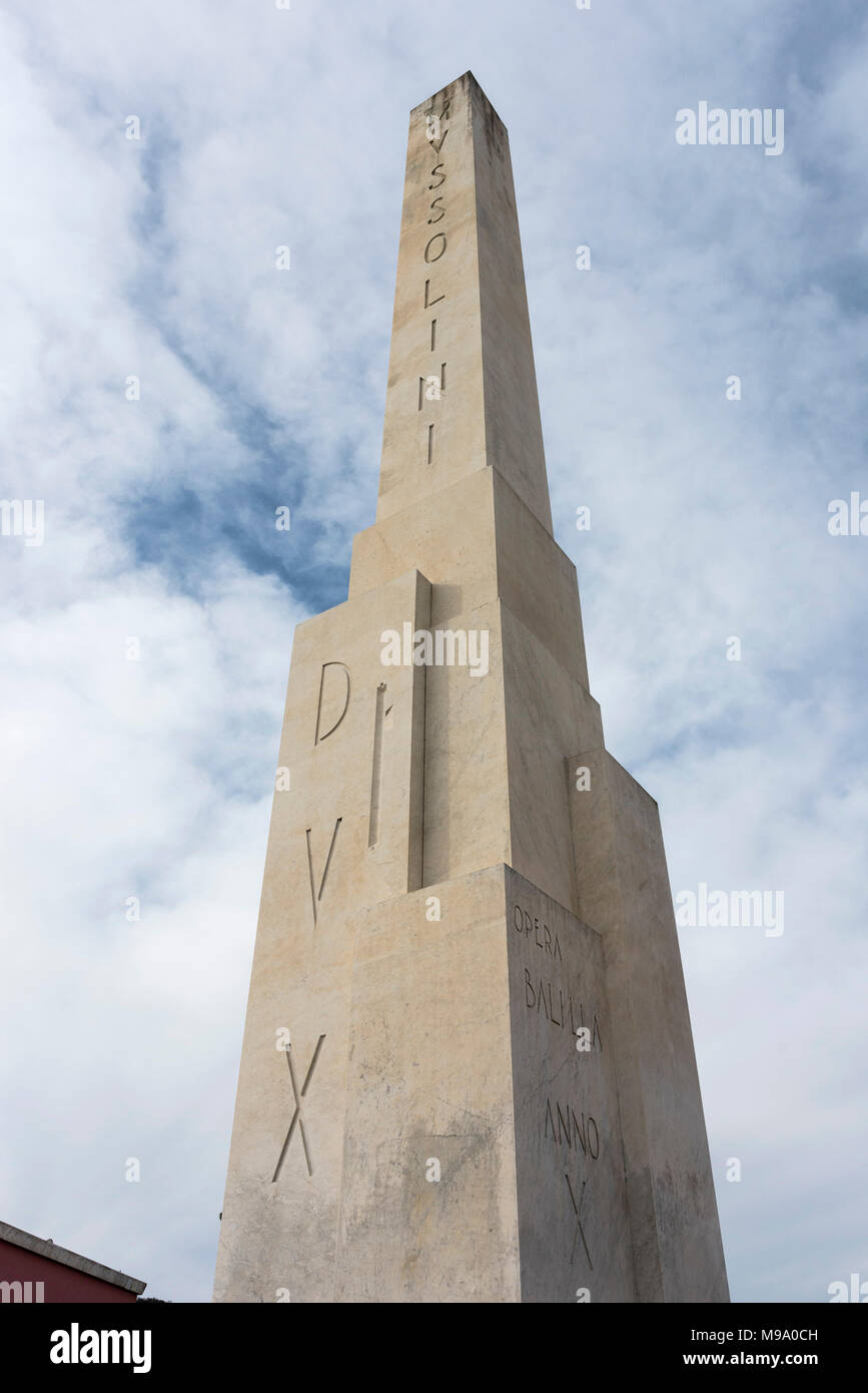 Rome. Italy. Obelisk at the entrance to the Foro Italico, bearing the insciption 'Mussolini Dux'.  The monument was created after an offer of a giant  Stock Photo