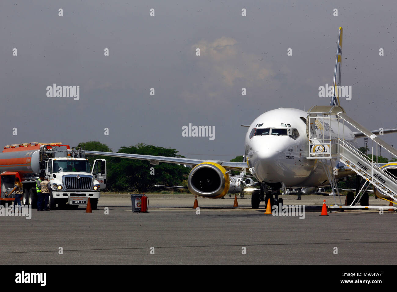 Valencia, Carabobo, Venezuela. 23rd Mar, 2018. March 23, 2018. The Turpial airline opened a new air route between the cities of Valencia in Venezuela to Santo Domingo and Punta Cana, in the Dominican Republic and vice versa. The regularity will be two days a week, Monday and Friday. The inaugural flight was 8606, with 30 passengers plus the crew departed from the Arturo Michelena airport. Photo: Juan Carlos Hernandez Credit: Juan Carlos Hernandez/ZUMA Wire/Alamy Live News Stock Photo