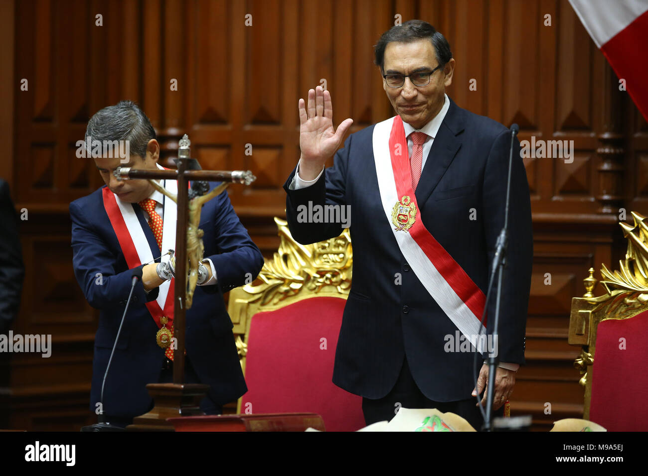 23 March 2018, Peru, Lima: Martin Vizcarra (R) is being sworn in as head of state in the parliament. The 55-year-old took over the office after Kuczynski's withdrawal. Previously, the parliament had accepted Kuczynski's resign with a large majoraty. The current term goes until 2021. Photo: Juan Osorio/dpa Stock Photo