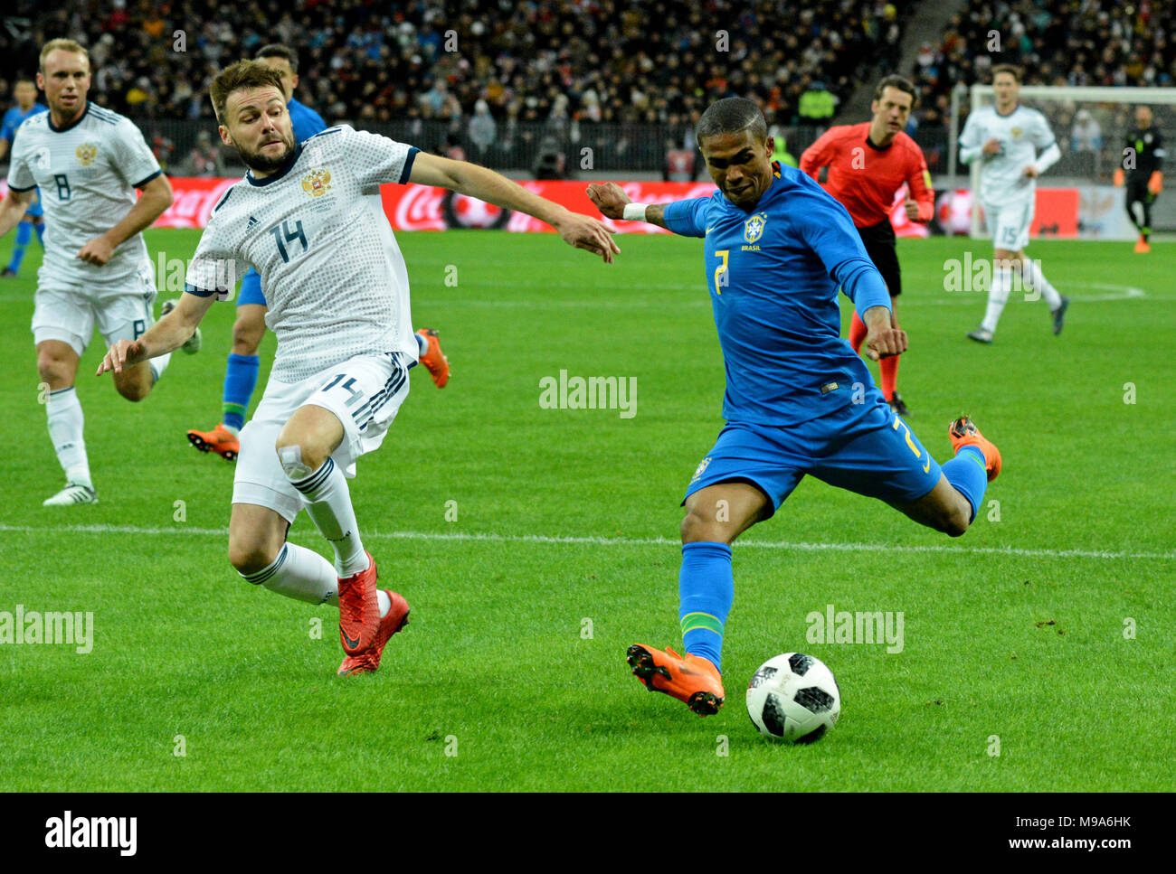 Moscow, Russia - March 23, 2018. Russian centre-back Vladimir Granat and Brazilian winger Douglas Costa during international test match Russia vs Brazil in Moscow. Credit: Alizada Studios/Alamy Live News Stock Photo