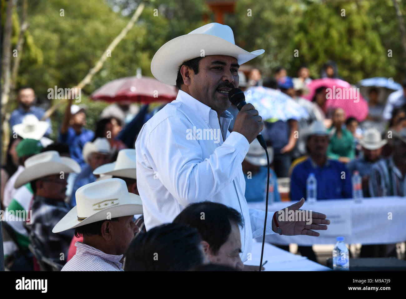 Colonia Gonzalez Ortega, Zacatecas, Mexico. 23rd Mar, 2018. Zacatecas Representative, Santiago Dominguez, speak to farmers Friday as residents of rural Colonia Gonzalez Ortega, Zacatecas, rallied along with 20 other towns to become an independent municipality breaking out from Sombrerete in the hope of improving services such as water and infrastructure which are currently worse than some places in Sub-Saharan Africa. The central Mexican town is in many ways the quintessential Revolutionary Mexican town-- founded in 1928 -- and evolved into the ''grain silo'' of the country. It has suffere Stock Photo
