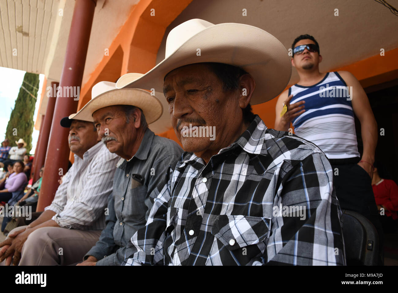 Colonia Gonzalez Ortega, Zacatecas, Mexico. 23rd Mar, 2018. Farmers listen to officials Friday as residents of rural Colonia Gonzalez Ortega, Zacatecas, rallied along with 20 other towns to become an independent municipality breaking out from Sombrerete in the hope of improving services such as water and infrastructure which are currently worse than some places in Sub-Saharan Africa. The central Mexican town is in many ways the quintessential Revolutionary Mexican town-- founded in 1928 -- and evolved into the ''grain silo'' of the country. It has suffered over the years due to half its pop Stock Photo