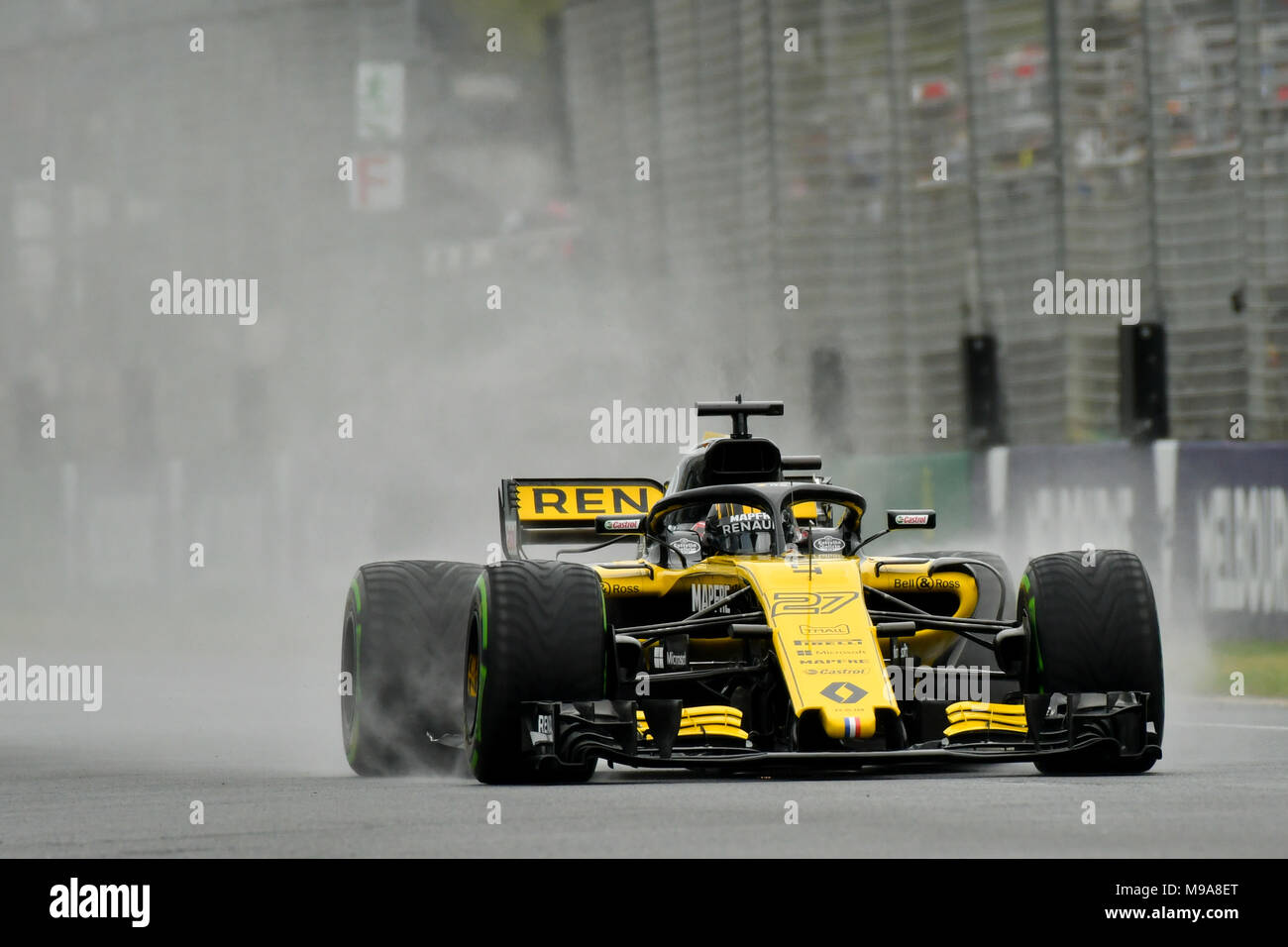 Albert Park, Melbourne, Australia. 24th Mar, 2018. Nico Hulkenberg (DEU) #27 from the Renault Sport F1 team creates a rooster tail down the main straight during practice session three at the 2018 Australian Formula One Grand Prix at Albert Park, Melbourne, Australia. Sydney Low/Cal Sport Media/Alamy Live News Stock Photo