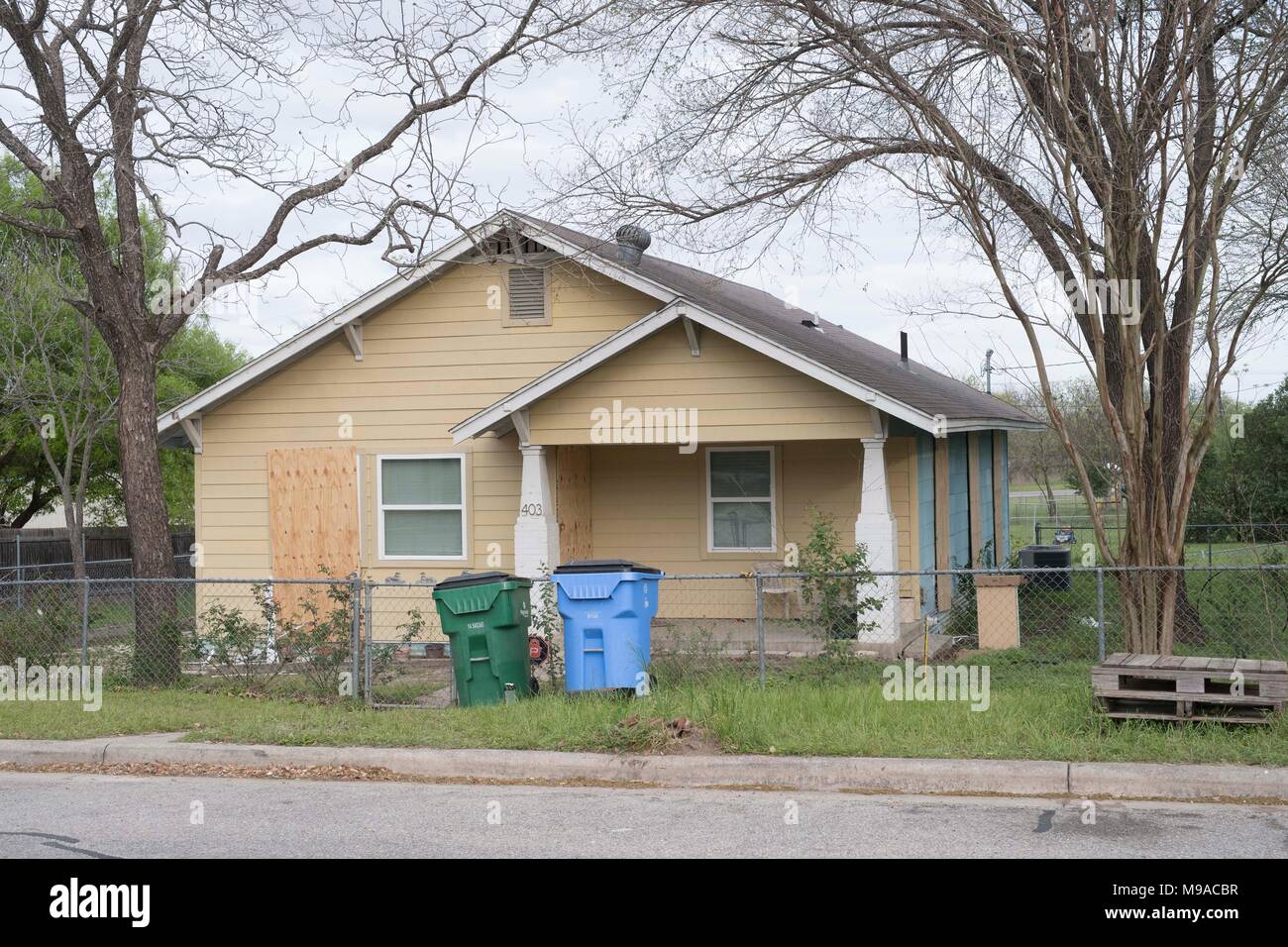 The home of alleged serial bomber Mark A. Conditt sits boarded up in Pflugerville, TX, after being secured by a bomb squad. Stock Photo