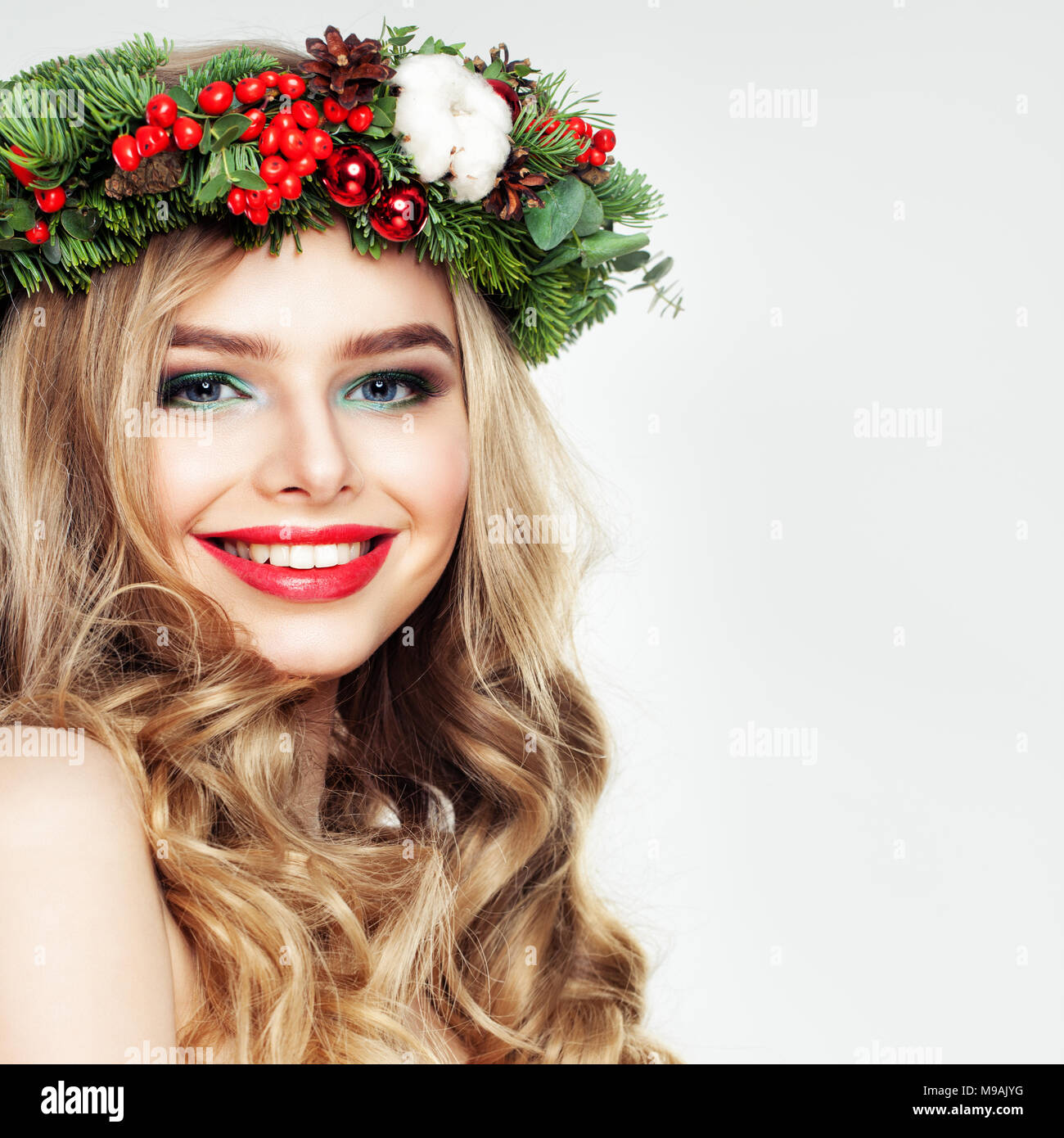 Beautiful Smiling Woman With Wavy Hair And Christmas Wreath