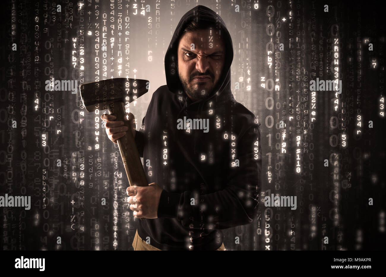 Masked and armed anonymous hacker breaking in cyber security cloud data concept  Stock Photo