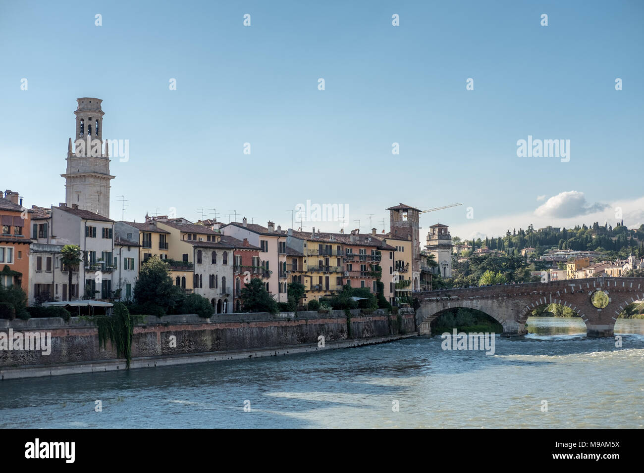 View of Verona. Ponte Pietra, once known as the Pons Marmoreus. It is the Roman arch bridge crossing Adige River Stock Photo