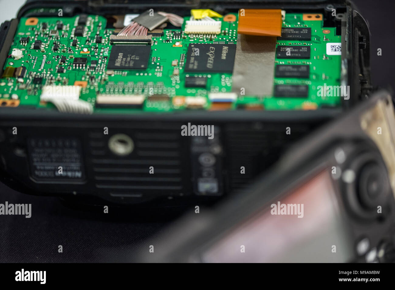 Reparing electronics devices, hands and tools, mobiles and computers. Nion reparing Stock Photo