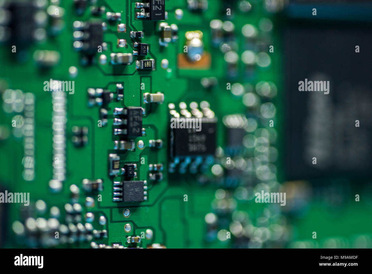 Reparing electronics devices, hands and tools, mobiles and computers. Nion reparing Stock Photo