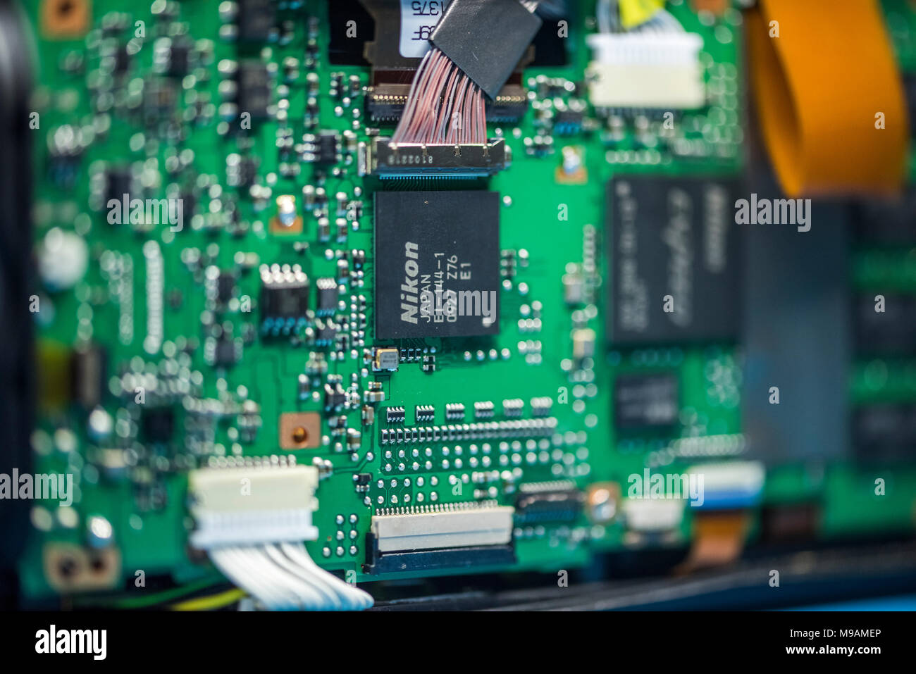 Reparing electronics devices, hands and tools, mobiles and computers. Nion reparing Stock Photo