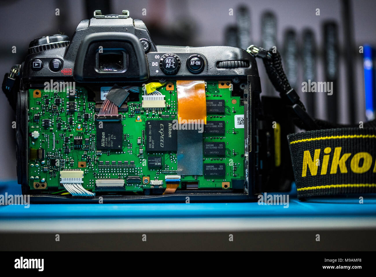Reparing electronics devices, hands and tools, mobiles and computers. Nion reparing Stock Photo