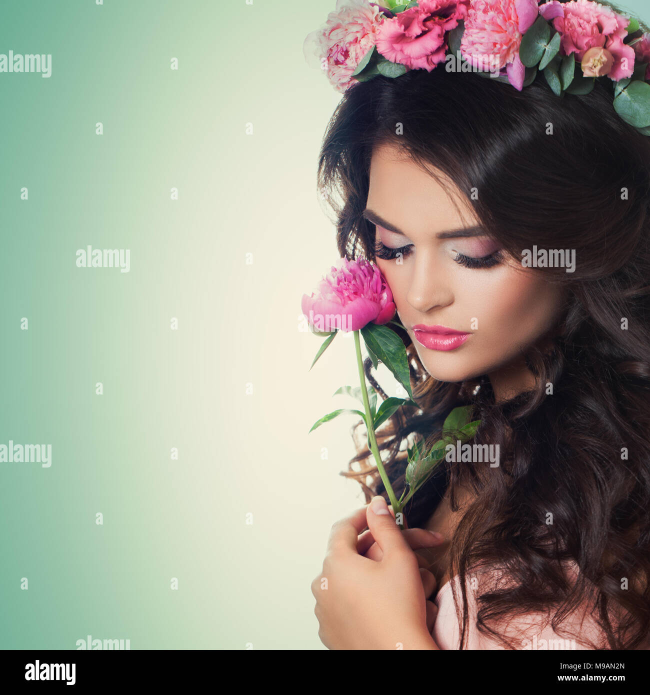 Beautiful Woman With Peony Flower On Green Background Relaxing Model With Makeup Curly Hair And Flowers Wreath Stock Photo Alamy