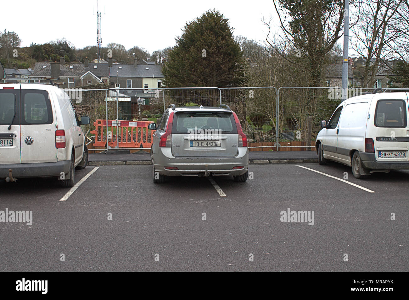 examples of bad or selfish parking, taking up 2 parking bays in a car park Stock Photo