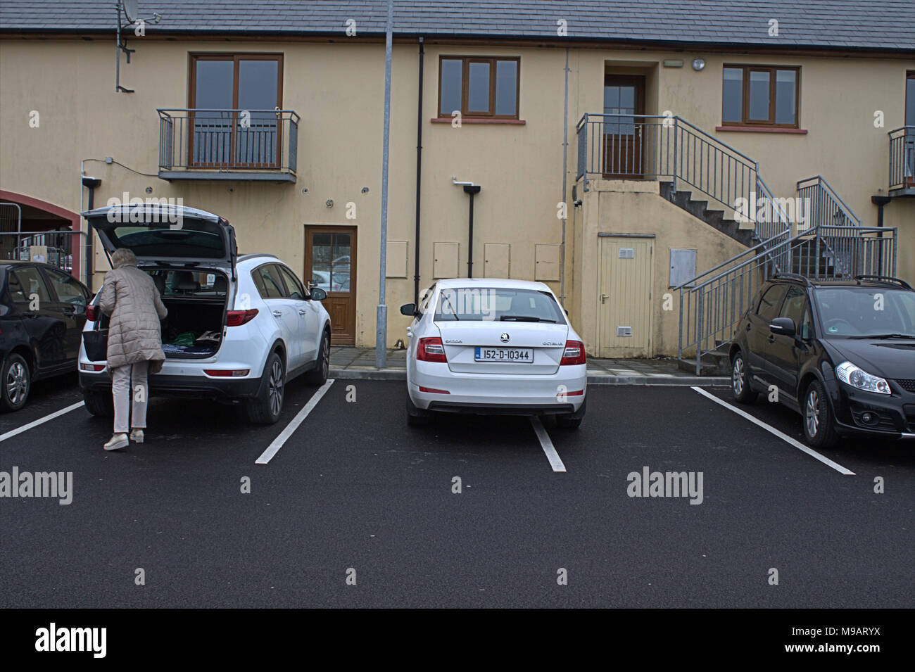 examples of bad or selfish parking, taking up 2 parking bays in a car park Stock Photo