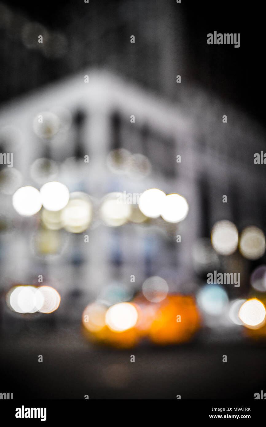Defocus blur of New York City street scene at night with cars and ...