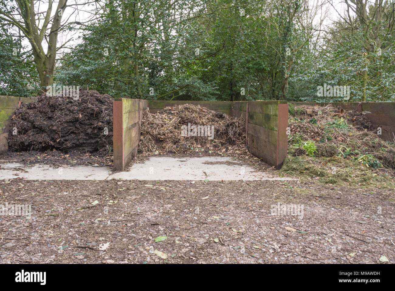 Composting - heaps of compost at different stages of the process Stock Photo