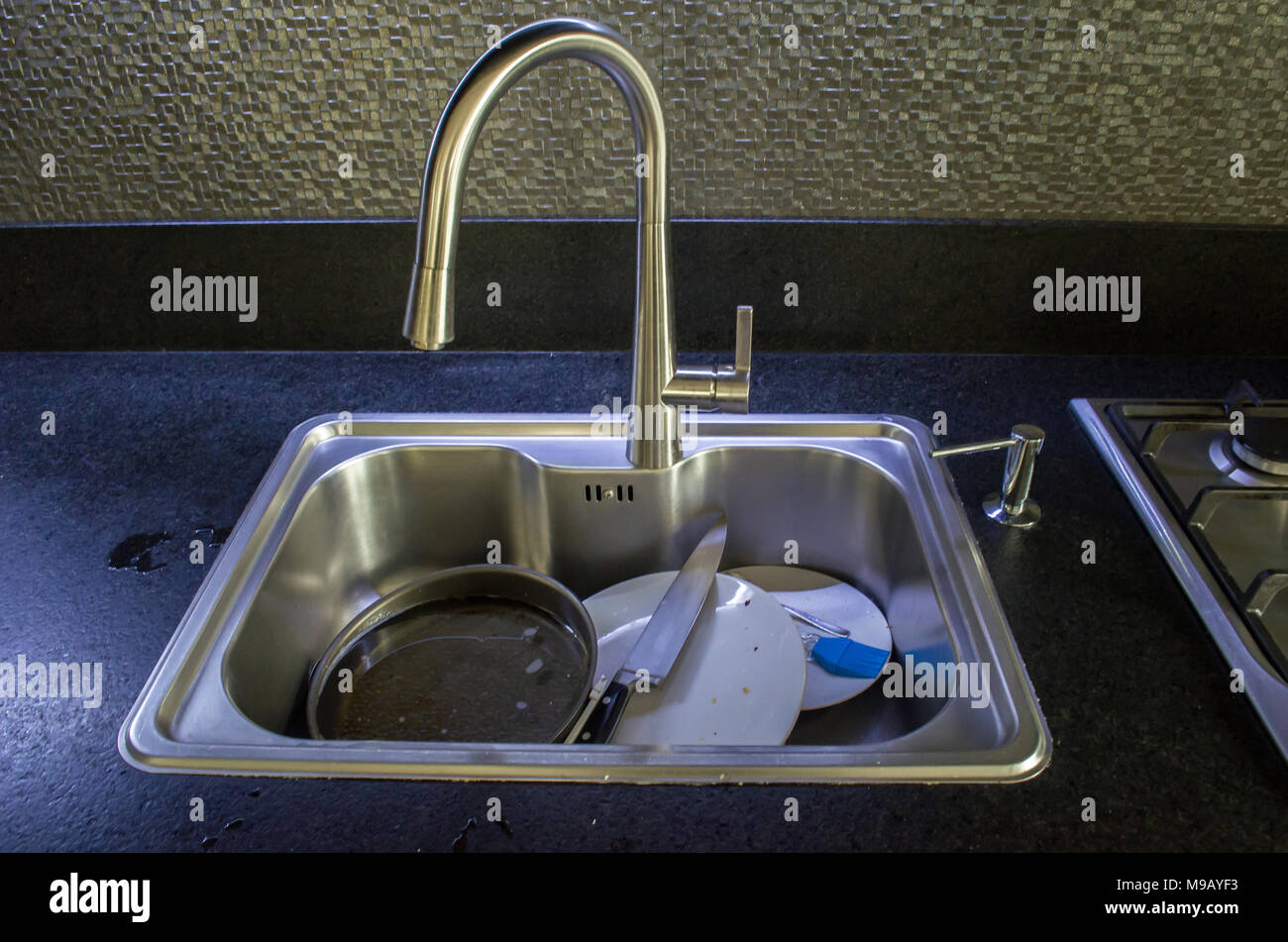 Unwashed dishes in sink close Stock Photo