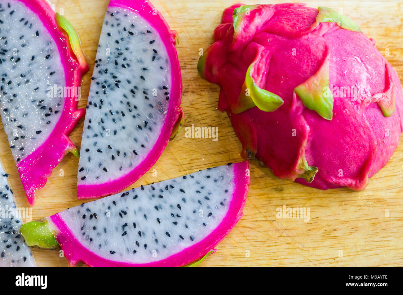 Pitaya Fruit slices on wood Stock Photo