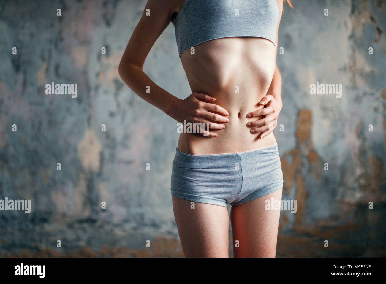 https://c8.alamy.com/comp/M9B2N8/female-with-slim-waist-weight-loss-anorexia-M9B2N8.jpg