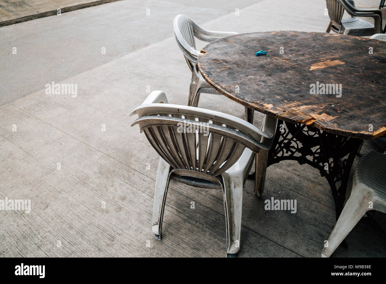 Empty wooden table and chair Stock Photo - Alamy