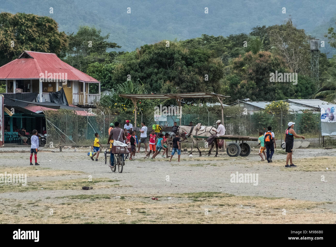 Capurgana, Colombia - march 2018: Kids playing soccer in the streets of  Capurgana, Colombia Stock Photo