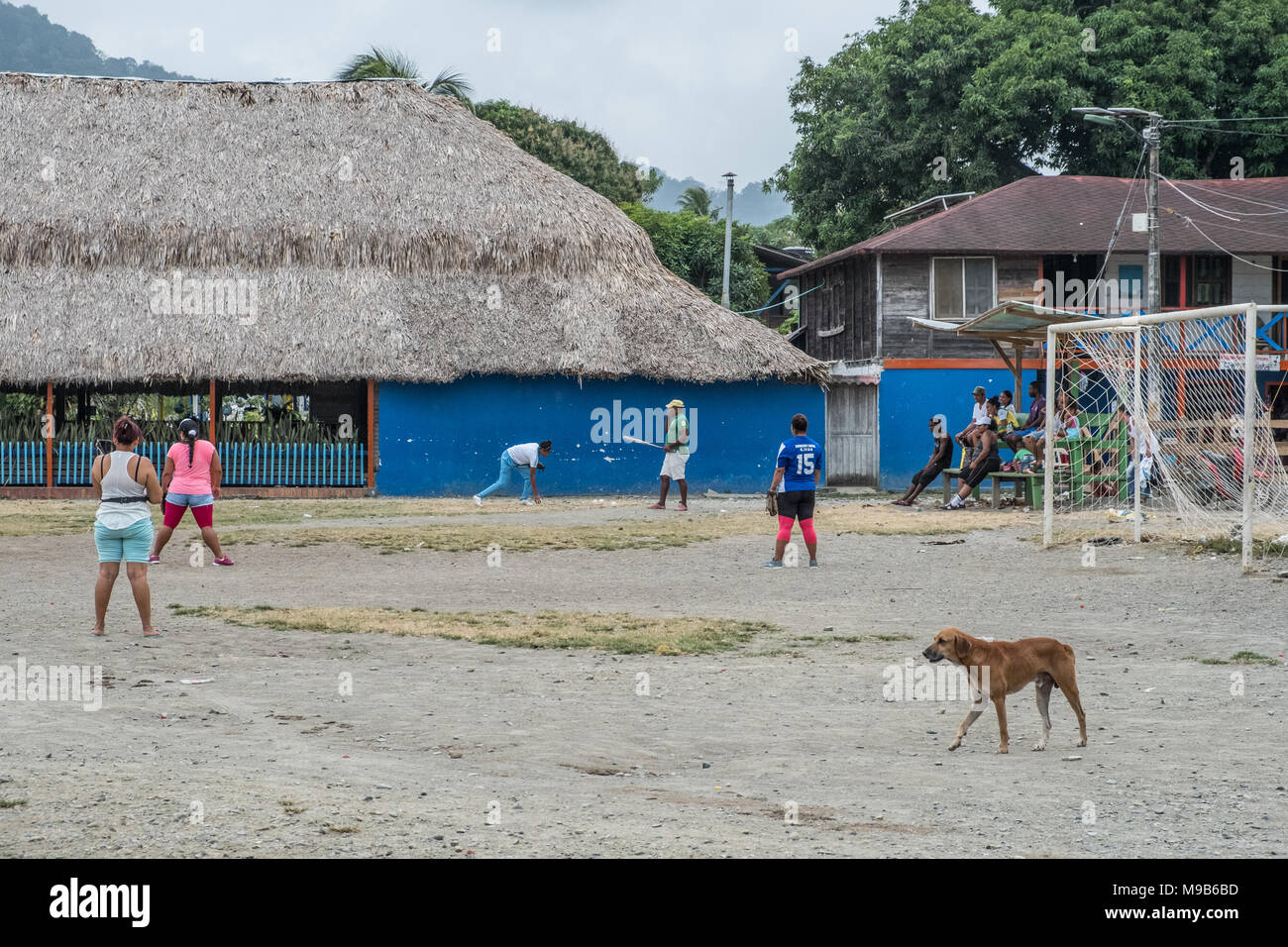 Capurgana, Colombia - march 2018: Street scene of people playing baseball at village center in  Capurgana, Colombia Stock Photo