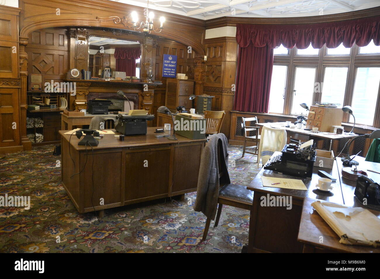 Bletchley Park. Inside the library in the manor house at Bletchley Park codebreaking offices. Typewriter, telephone. Stock Photo