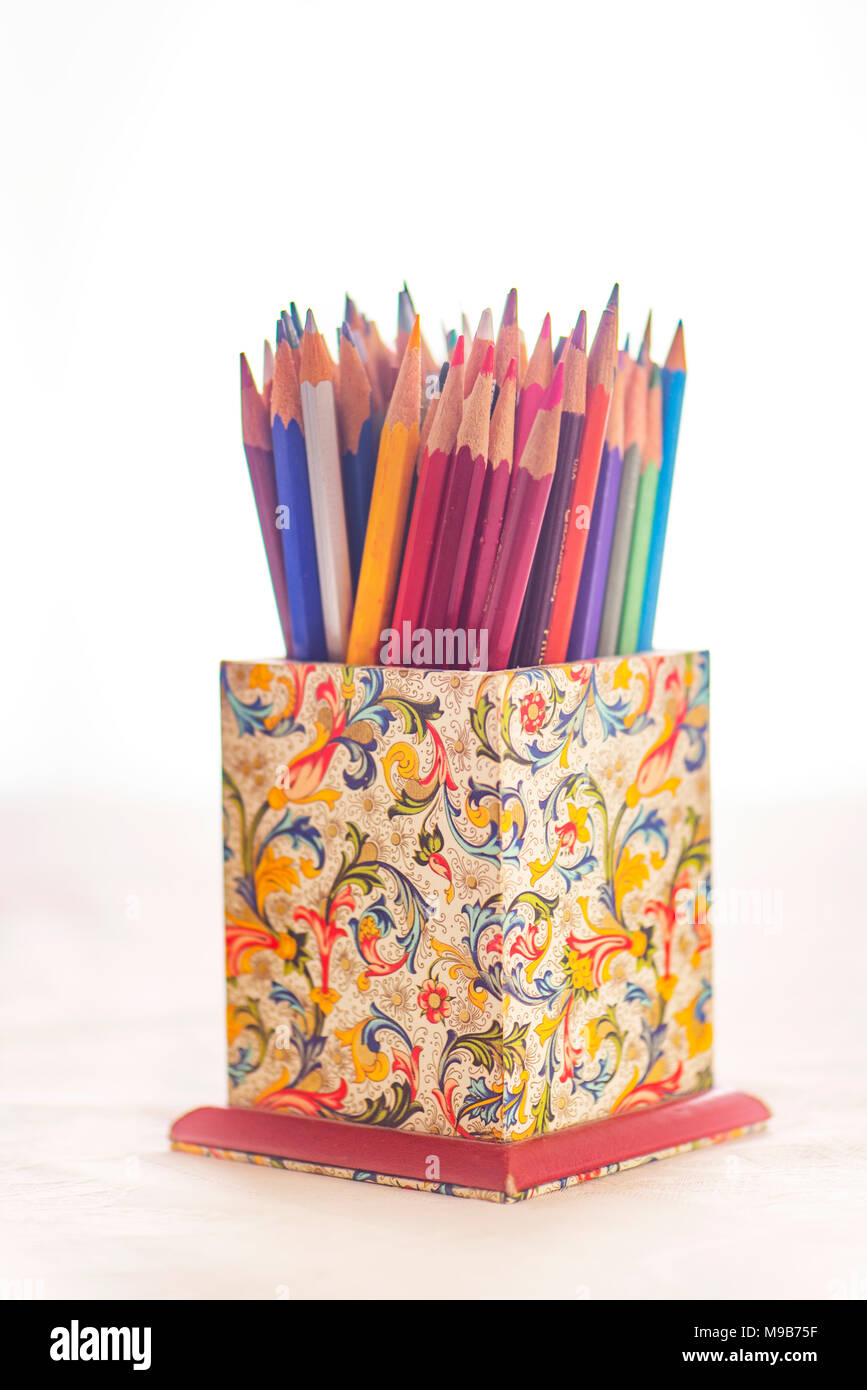 Colored pencils in a Florentine design holder Stock Photo