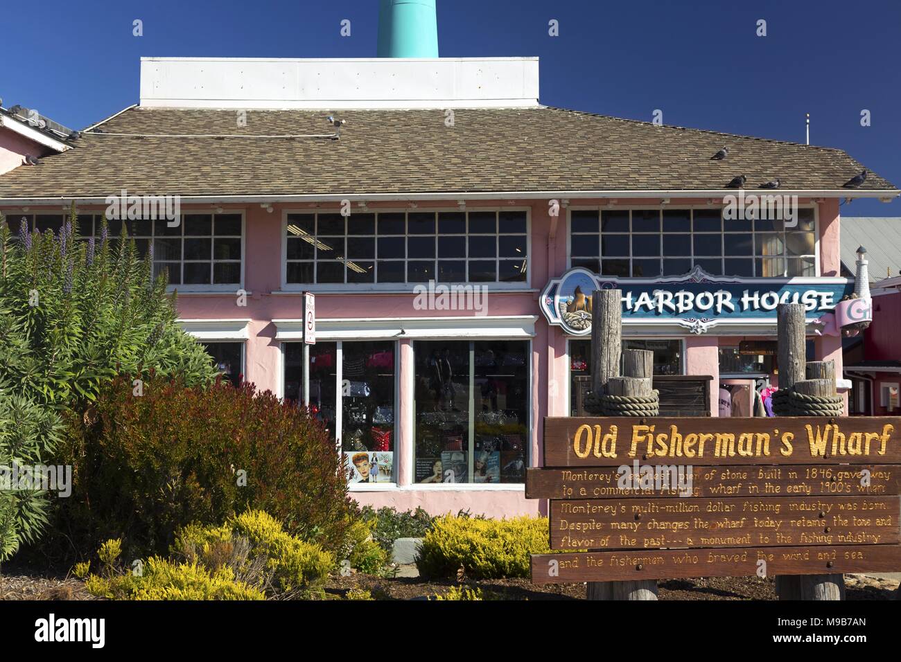 Harbor House Building Facade Exterior with Blue Sky at Entrance to World Famous Old Fisherman’s Wharf on Monterey Peninsula California USA Stock Photo