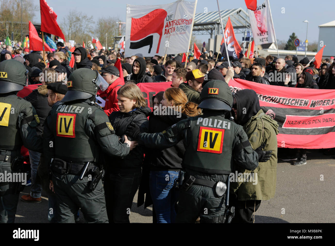 Police officers in riot gear have surrounded the Antifa block at the rally and are pushing back two protesters. Around 2,000 anti-fascists from different political parties and organisations marched through the city of Kandel, to show their opposition to the march by the right-wing AfD party that was taking part at the same time and which used the remembrance of the murder of a girl late last year by an Asylum seeker, as pretext for a right-wing and racist protest. The protest was attended by the Rhineland-Palatinate Minister?President Malu Dreyer and politicians from all democratic parties. (P Stock Photo