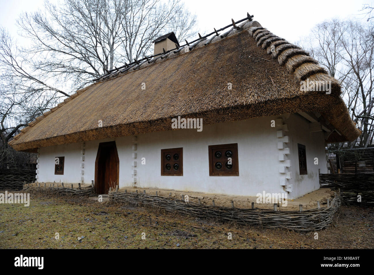 View of reconstructed Ukrainian rural household of 17 century at Mamaeva Sloboda. March 23, 2018. Kiev, Ukraine Stock Photo