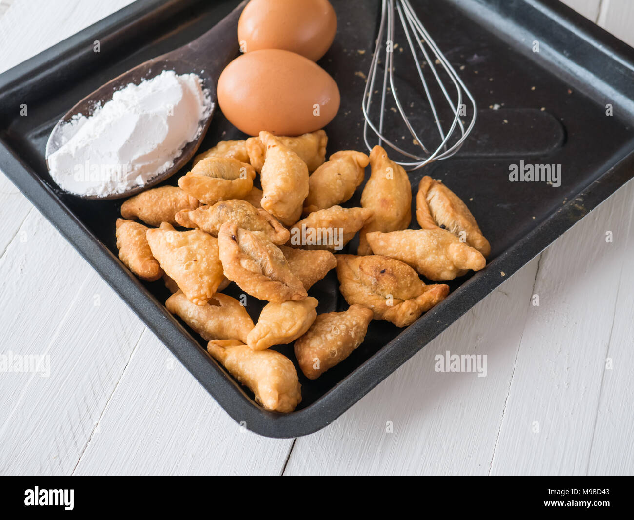 Karee puff, eggs and powder on white wooden background, Ingredients for cooking baking flour