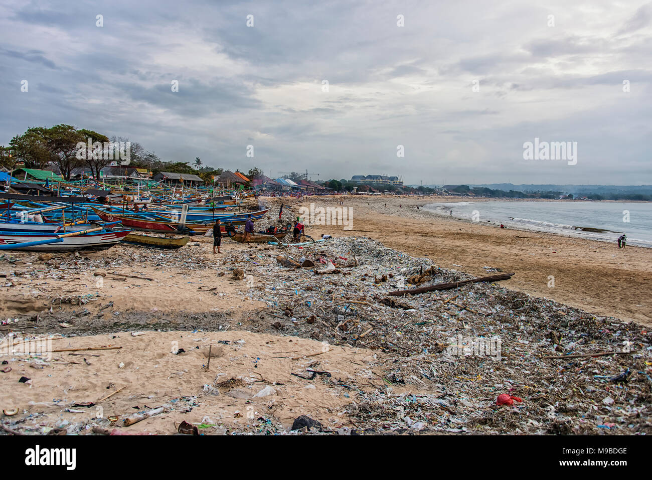 BALI, INDONESIA - FEBRUARY 2018: Beach pollution on the Bali beach near Kuta. Many garbage on the beach Stock Photo