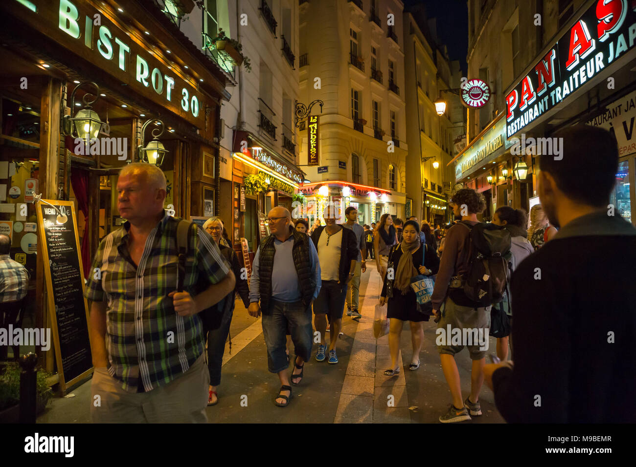 Latin Quarter of Paris, France. Narrow street of Paris among old traditional parisian houses and