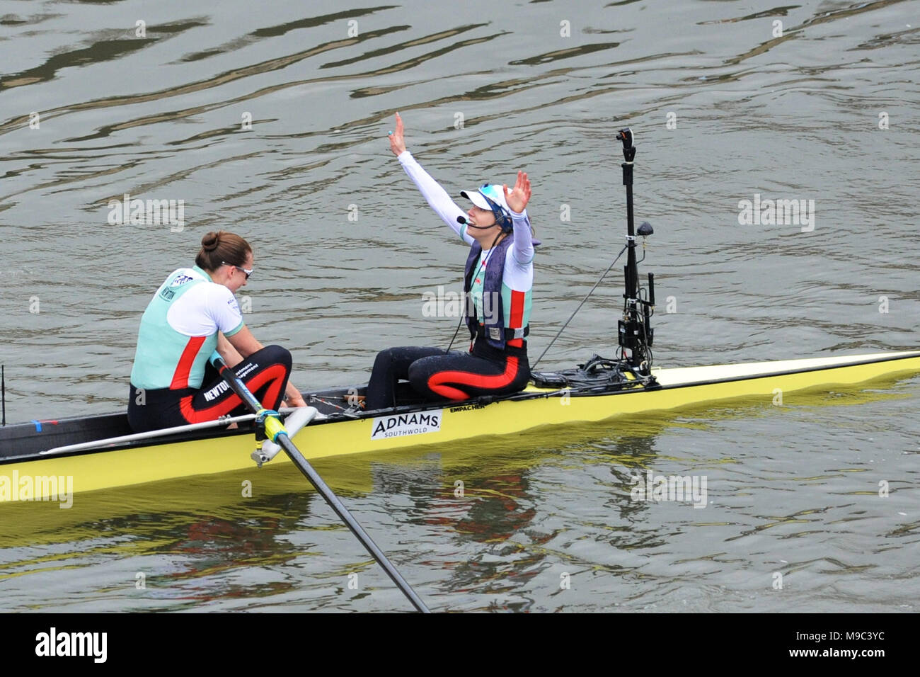London, UK, 24 Mar 2018. Sophie Shapter, Cambridge Cox (GBR, St Catharine’s) celebrating their win just after crossing the finish line in The Cancer Research UK Women’s Boat Race.  The rower to her left is Olivia Coffey (USA, Homerton) the Cambridge boat's Stroke.     Credit: Michael Preston/Alamy Live News Stock Photo