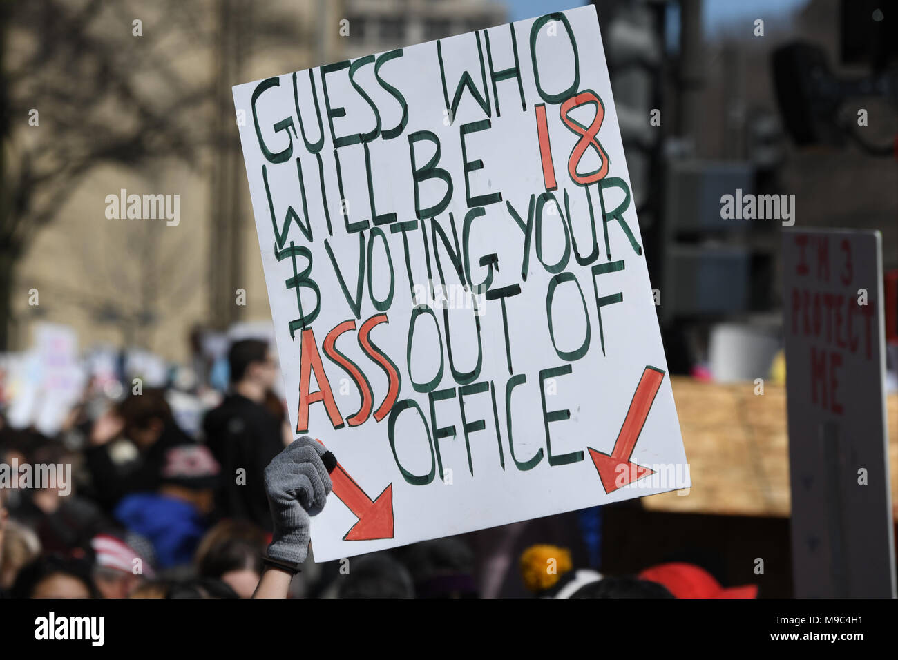 Washington, DC, USA. 24th Mar, 2018. A protester holds up a sign warning politicians during the March for your Lives protest and march for gun control in the United States, held on Pennsylvania Avenue in Washington, DC. Credit: csm/Alamy Live News Stock Photo