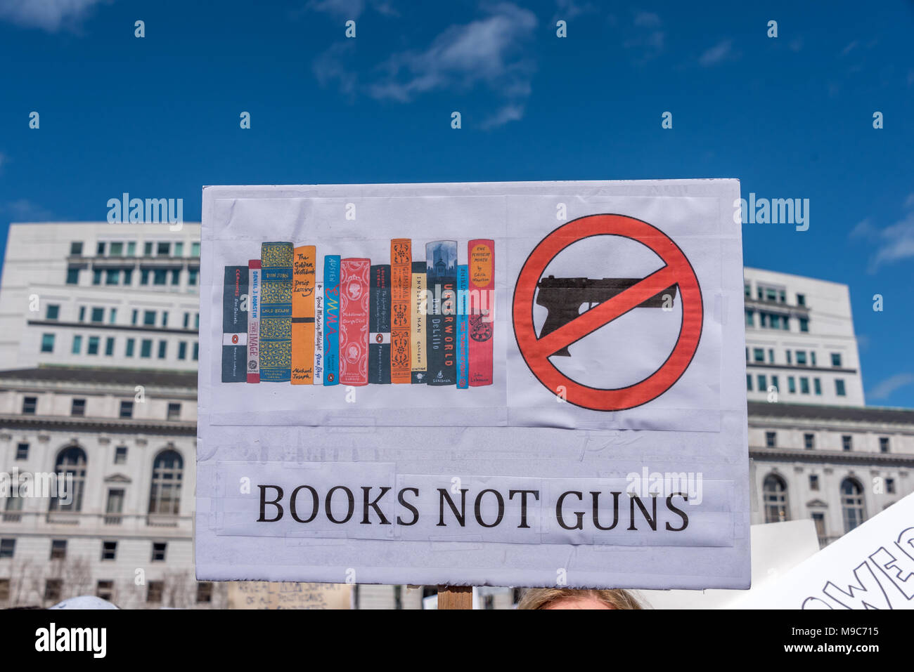 San Francisco, USA. 24th March, 2018. A sign reading 'books not guns' rises above the crowd at the March for Our Lives rally and march to call for gun control and end gun violence. Shelly Rivoli/Alamy Live News Stock Photo