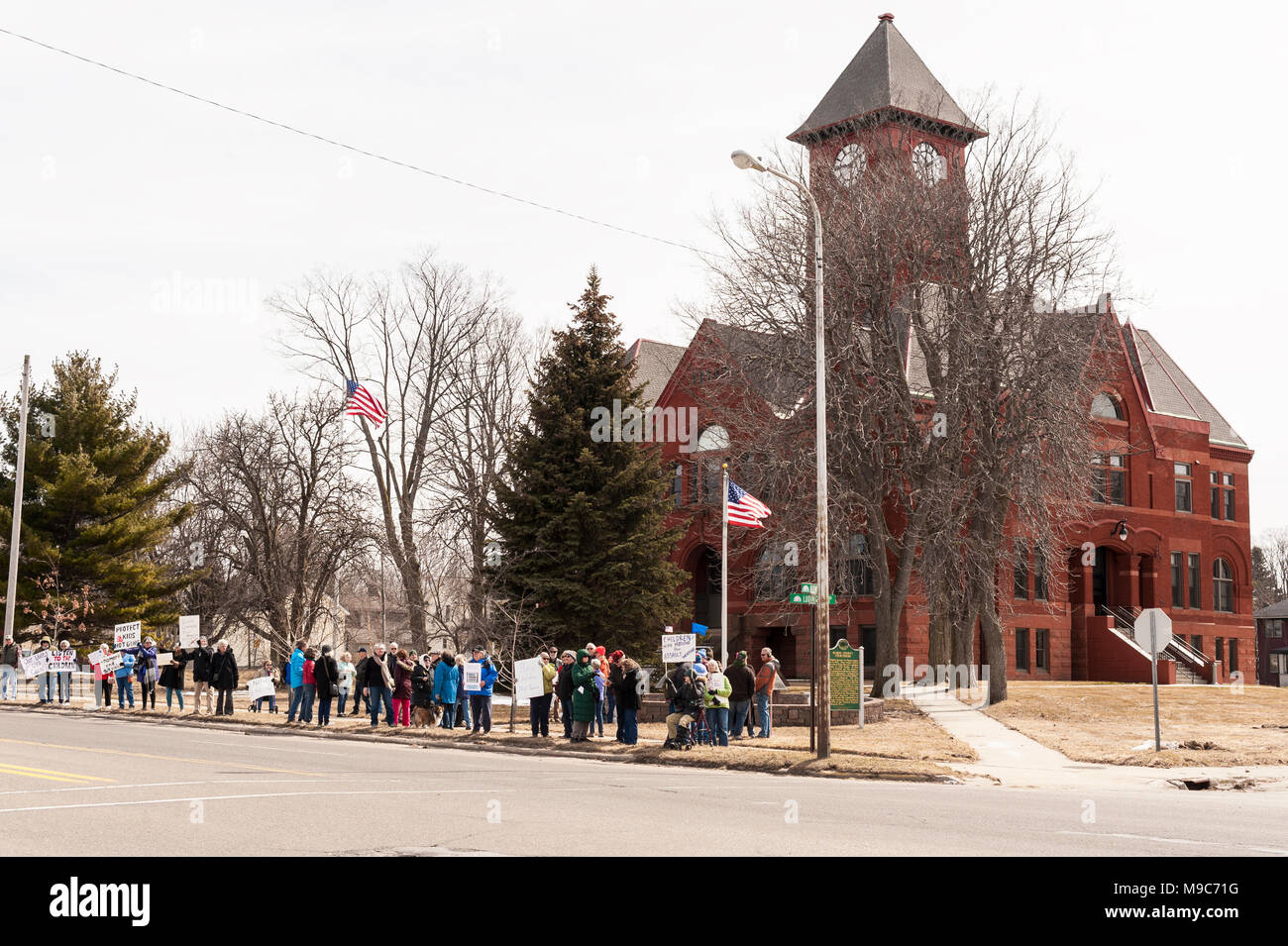 Ludington, Michigan, USA.  24 March 2018.  March for our lives protesters in front of the Mason County Courthouse, showing their support for gun control in the wake of the Marjory Stoneman Douglas High School shooting in Parkland, Florida, USA on February 14.  Credit, Jeffrey Wickett/Alamy Live News. Stock Photo