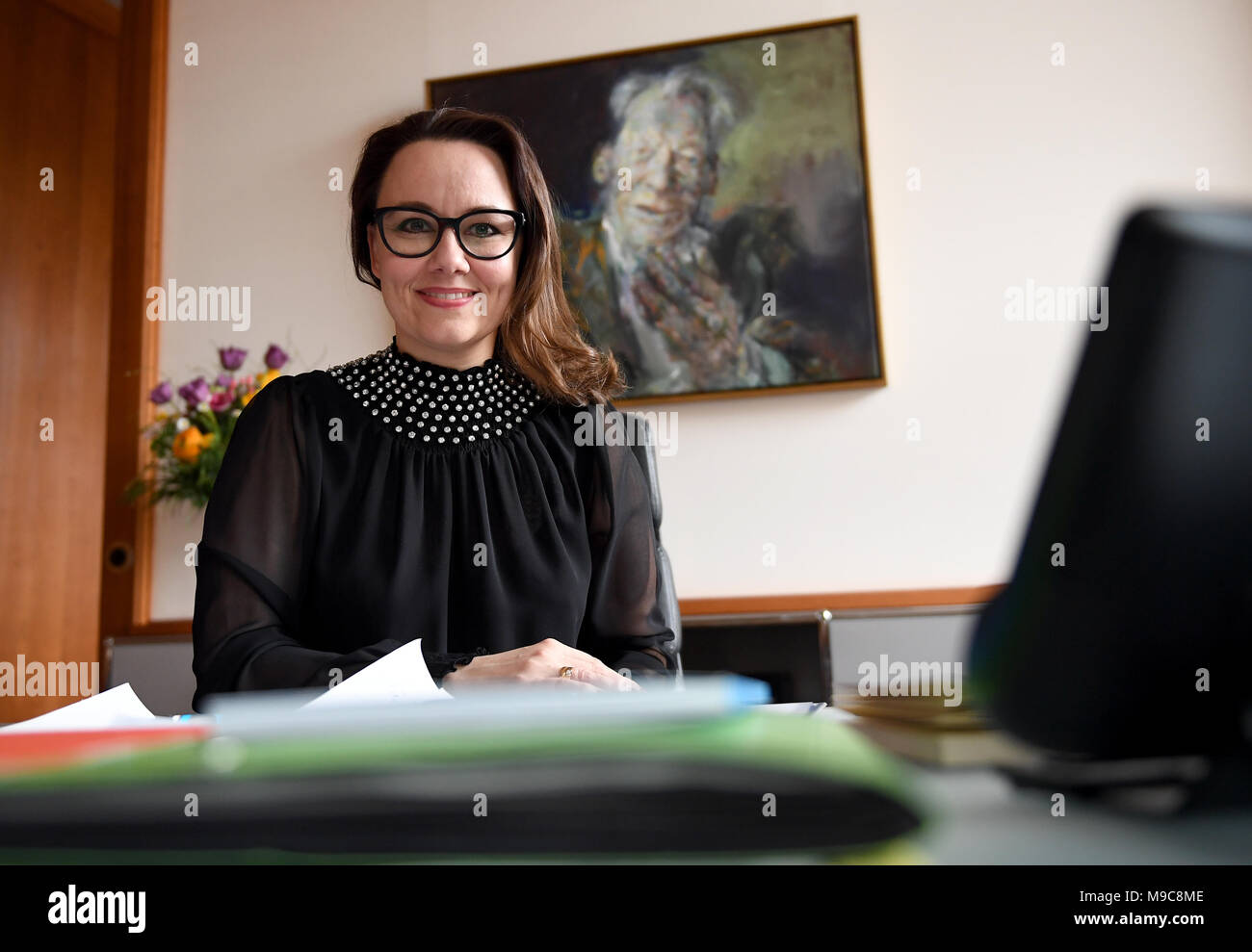 23 March 2018, Germany, Berlin: Michelle Muentefering of the Social Democratic Party (SPD), State Minister at the Federal Foreing Office, sits in her office in front of a painting of Willy Brandt. Photo: Britta Pedersen/dpa-Zentralbild/ZB Stock Photo