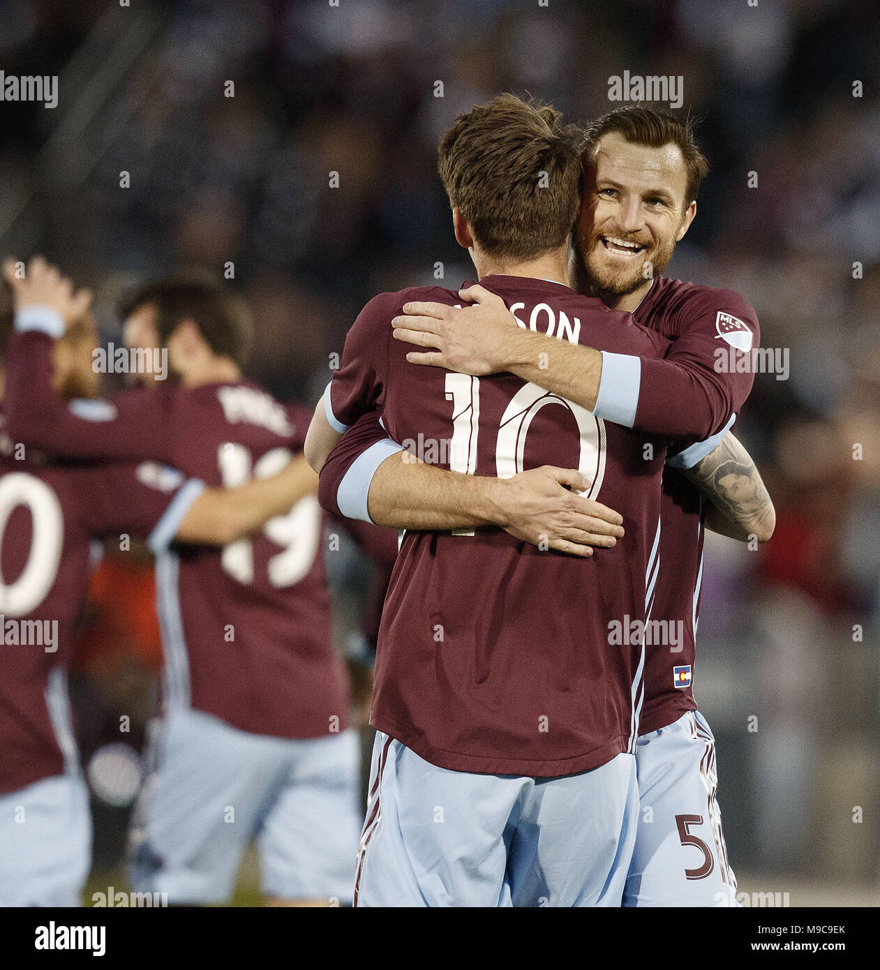 Commerce City, Colorado, USA. 24th Mar, 2018. Rapids MF JOE MASON, center, gets a congrat from team mate D TOMMY SMITH, right, after scoring his teams 2nd. goal of the night during the 1st. Half at Dick's Sporting Goods Park Saturday Night. The Rapids tie Sporting KC 2-1. Credit: Hector Acevedo/ZUMA Wire/Alamy Live News Stock Photo