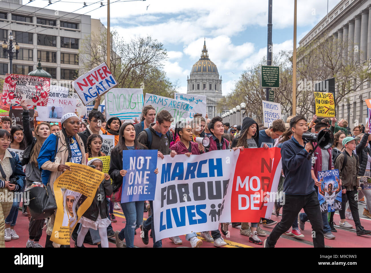 San Francisco, USA. 24th March, 2018. March for Our Lives rally and march to call for gun control and end gun violence; the marching begins as these students lead thousands of marchers from Civic Center down Market Street. Signs read 'March for our lives,' 'Not one more,' 'Never again,' 'Enough' and 'Protect kids not guns.' Shelly Rivoli/Alamy Live News Stock Photo