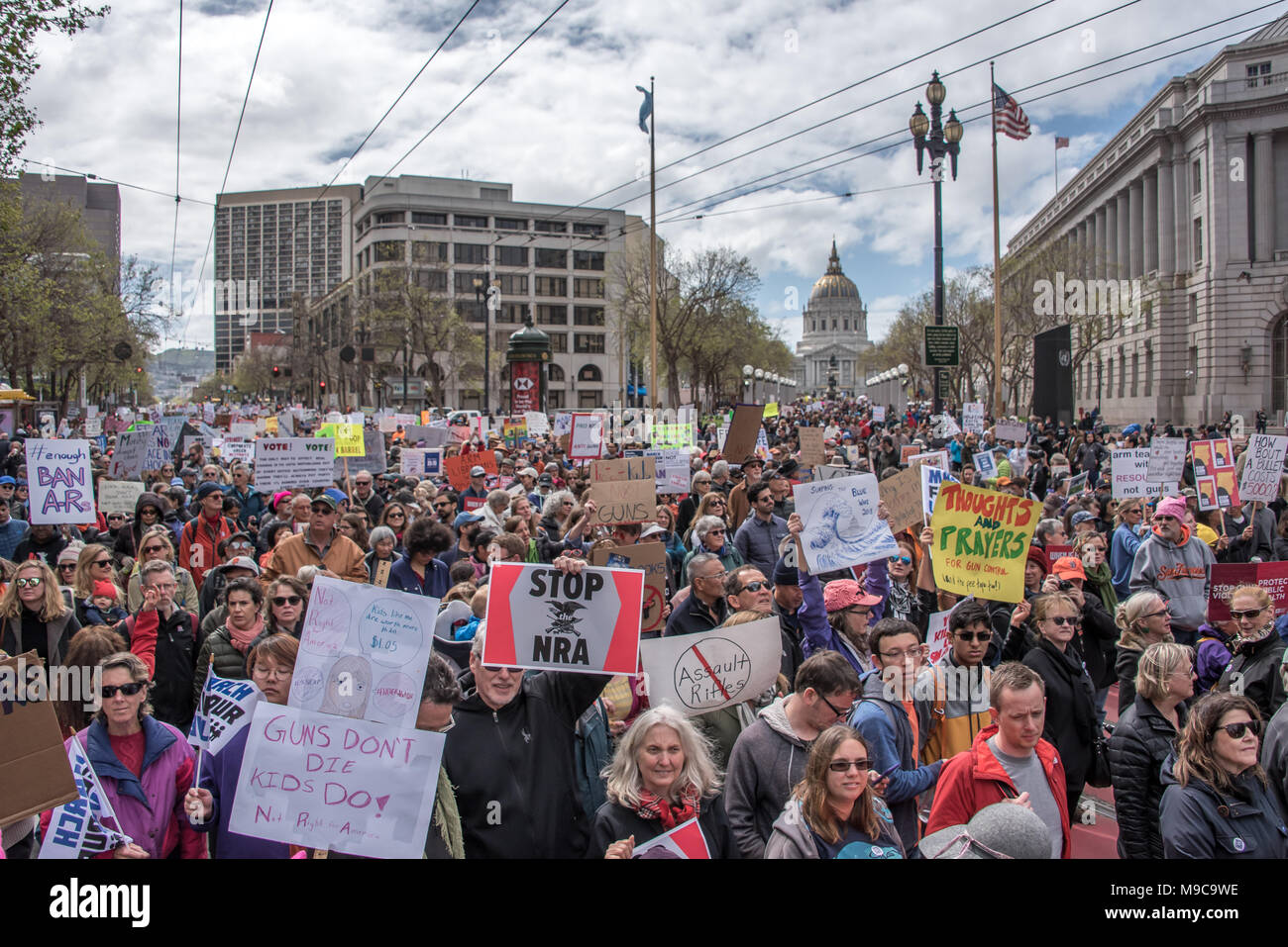 San Francisco, USA. 24th March, 2018. March for Our Lives rally and march to call for gun control and end gun violence; thousands march down Market Street in San Francisco filling the street from side to side and back toward the Civic Center/UN Plaza. Signs read 'Stop NRA,' 'Gunsdon't die, kids do,' 'Ban ARs' among others calling for gun control. Shelly Rivoli/Alamy Live News Stock Photo