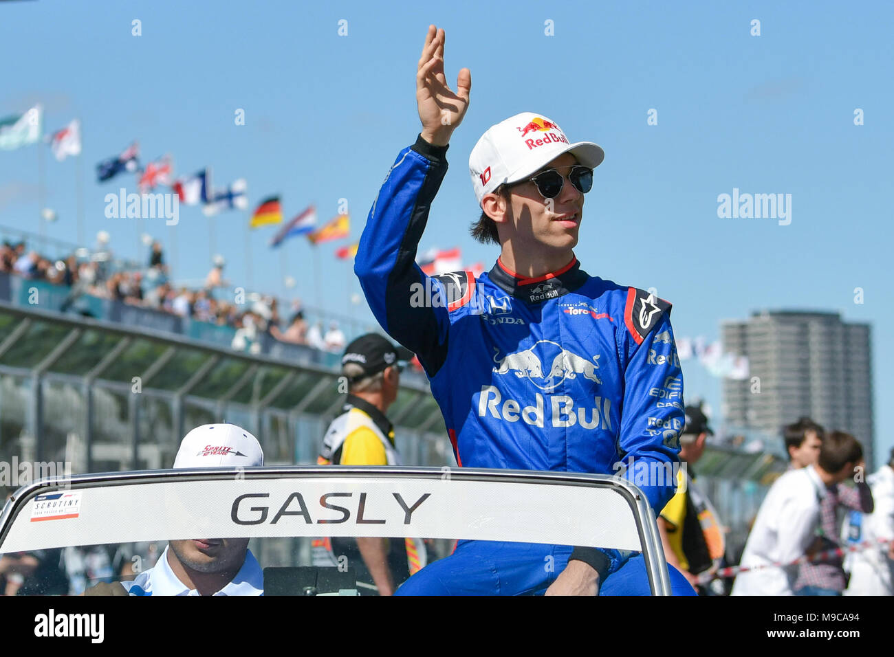 Albert Park, Melbourne, Australia. 25th Mar, 2018. Pierre Gasly (FRA) #10 from the Red Bull Toro Rosso Honda team waves to the crowd during the drivers' parade at the 2018 Australian Formula One Grand Prix at Albert Park, Melbourne, Australia. Sydney Low/Cal Sport Media/Alamy Live News Stock Photo