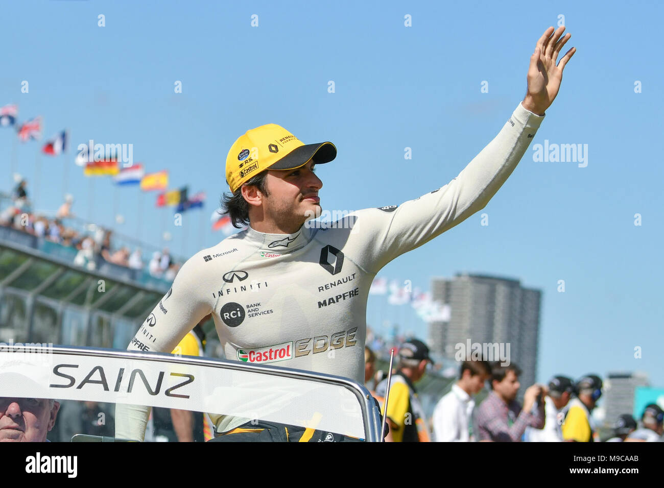Albert Park, Melbourne, Australia. 25th Mar, 2018. Carlos Sainz Jnr (ESP) #55 from the Renault Sport F1 team waves to the crowd during the drivers' parade at the 2018 Australian Formula One Grand Prix at Albert Park, Melbourne, Australia. Sydney Low/Cal Sport Media/Alamy Live News Stock Photo
